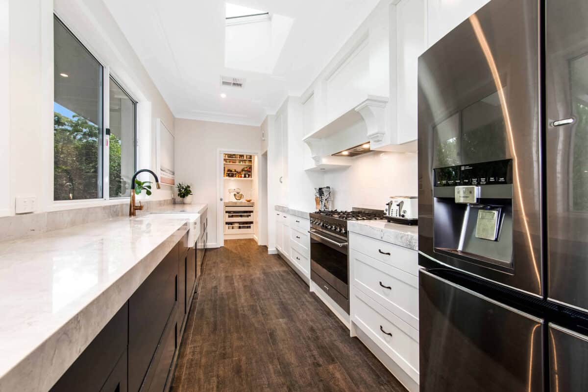 kitchen incorporates classic cabinetry with a modern twist